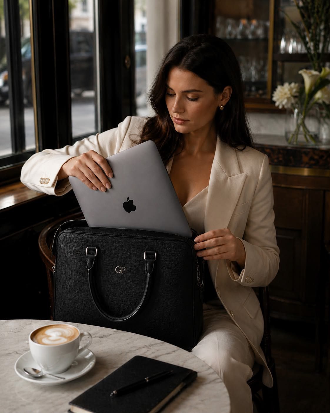 Woman placing laptop into a Gabriel Ferretti briefcase