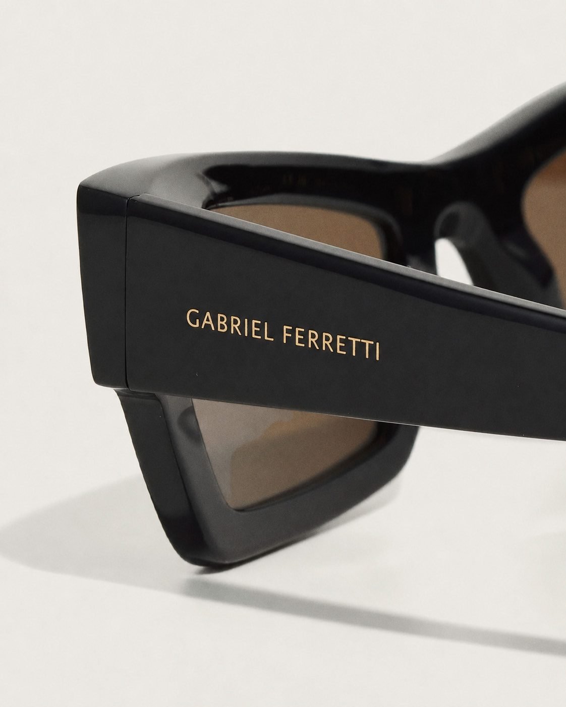 Burgundy oversized sunglasses on marble